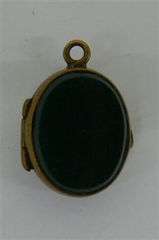 Uitklapbare ovalen reliekhouder met daarin een stukje textiel; Reliekhouder Reliekhouder