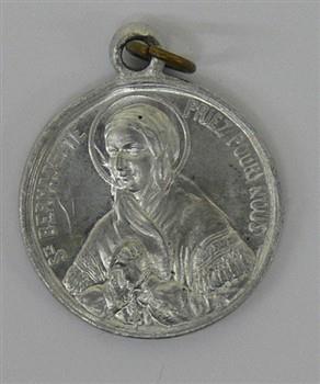 Medaille houdende een afbeelding van Bernadette Soubirous, met tekst: 'Ste Bernadette priez pour nous'.
Keerzijde houdende een afbeelding van Bernadette Soubirous bij de grot van Lourdes; Medaille Medaille