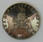 Jaarpenning houdende een afbeelding van paus Paulus VI, met tekst: 'Paulus VI Pontifex Maximus Anno I Giampaoli'.
Keerzijde houdende een afbeelding van het embleem van het Vaticaan, met tekst: 'Corona Aurea super caput eius XXX.VI MCMLXIII'; Jaarpenning Jaarpenning